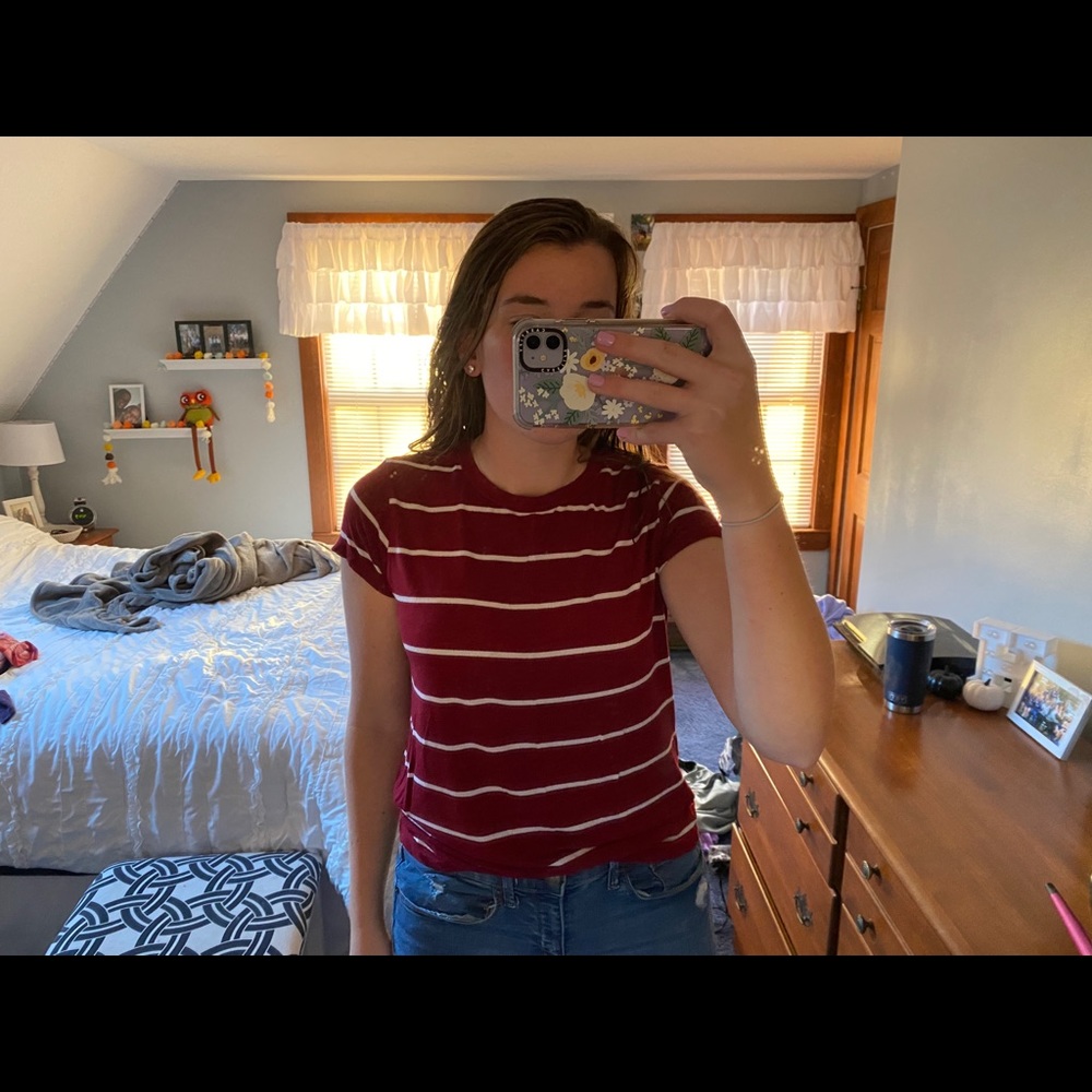 Maroon and white striped shirt.